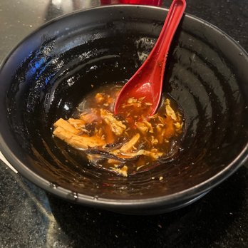 Kims Cuisine Asian Fusion Bistro - a red spoon in a black bowl - Chinese Near Me - Eagle River, Alaska Kims Cuisine Asian Fusion Bistro - a red spoon in a black bowl - Chinese Near Me - Eagle River, Alaska