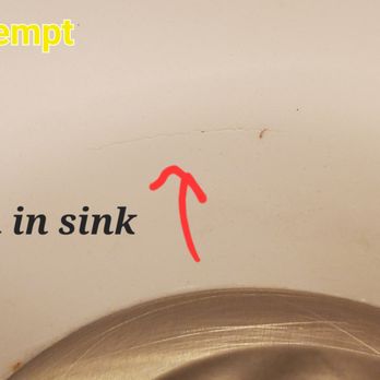 Re-Bath - a close up of a sink with a red arrow pointing to a scratch in the sink - General Contractors Near Me - Tucson, Arizona Re-Bath - a close up of a sink with a red arrow pointing to a scratch in the sink - General Contractors Near Me - Tucson, Arizona