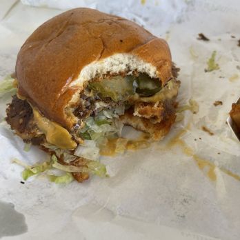 Palms n' Patties - Double burger one bite in. - Burgers Near Me - Costa Mesa, California Palms n' Patties - Double burger one bite in. - Burgers Near Me - Costa Mesa, California