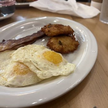 Maple Street Biscuit Company - Columbus - Two eggs over easy, 2 strips of bacon and their version of Smashbrowns (Sidekick) - Breakfast & Brunch Near Me - Columbus, Ohio Maple Street Biscuit Company - Columbus - Two eggs over easy, 2 strips of bacon and their version of Smashbrowns (Sidekick) - Breakfast & Brunch Near Me - Columbus, Ohio