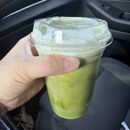 Matcha latte with blueberry cream top
