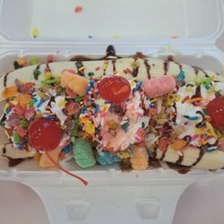 Pistachio, Ferrero, and cheesecake Ice creams, coconut, granola, Fruity Pebbles, sour gummy worms, chocolate sauce, whipped cream, sprinkles