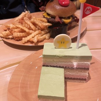 Toadstool Cafe - Mario Burger (Bacon, Mushroom & Cheese) - $16.99 & Mt. Beanpole Cake(VG)- $9.99 - Cafes Near Me - Universal City, California Toadstool Cafe - Mario Burger (Bacon, Mushroom & Cheese) - $16.99 & Mt. Beanpole Cake(VG)- $9.99 - Cafes Near Me - Universal City, California