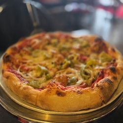 John The Baker - John the Baker Pizza: sausage, pepperoni, mushrooms, onions, and green peppers. Add anchovies upon request
