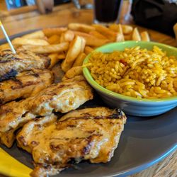 Nando's - Boneless chicken thighs, peri peri chips, rice