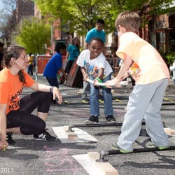 The Movement Creative - Instructor Caitlin Pontrella oversees two children learning how to play balance joust.