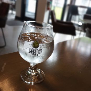 Wasted Day Brewing - a glass of water on a table - Breweries Near Me - Saint John, New Brunswick