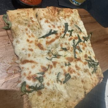 Tommy's Tavern + Tap - Cheesy garlic flatbread - American Near Me - Toms River, New Jersey Tommy's Tavern + Tap - Cheesy garlic flatbread - American Near Me - Toms River, New Jersey