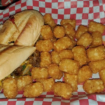 The Local - Philly cheese steak sandwich with tots - Bars Near Me - Charlotte, North Carolina The Local - Philly cheese steak sandwich with tots - Bars Near Me - Charlotte, North Carolina