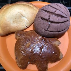 Pumpkin empanada, chocolate Concha, Marranitos (Mexican Gingerbread Pig)
