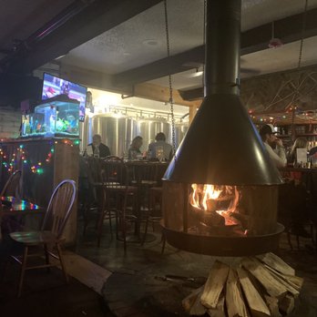 Pug Ryans Brewery - Wonderful cozy table with the fireplace sanda butar distillery/brewery, the classic IPA is awesome - American Near Me - Dillon, Colorado