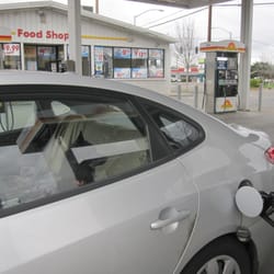 Sunshine Food & Gas - Bob fills the tank up.  Or, he at least watches as the car gets filled.