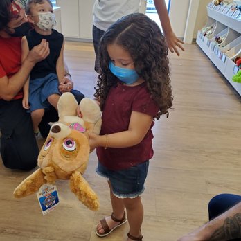 Build-A-Bear Workshop - Just finished building her doggie - Toy Stores Near Me - Orlando, Florida Build-A-Bear Workshop - Just finished building her doggie - Toy Stores Near Me - Orlando, Florida