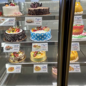 Maxim's Bakery - B-day cakes in the show case - Bakeries Near Me - Richmond, British Columbia
