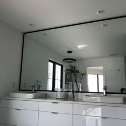 Bella Custom Glass - Stunning vanity mirror with black framing.