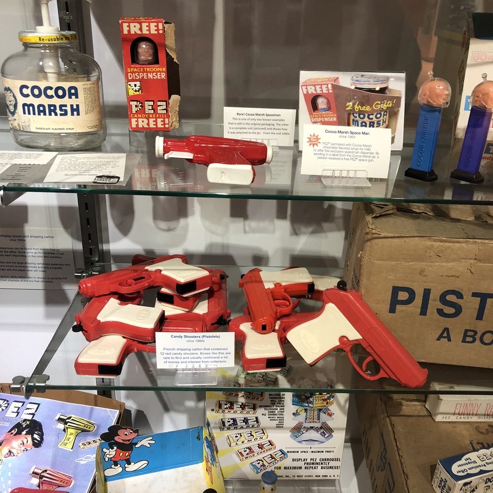 PEZ Visitor Center - a display of guns and other items - Candy Stores Near Me - Orange, Connecticut PEZ Visitor Center - a display of guns and other items - Candy Stores Near Me - Orange, Connecticut
