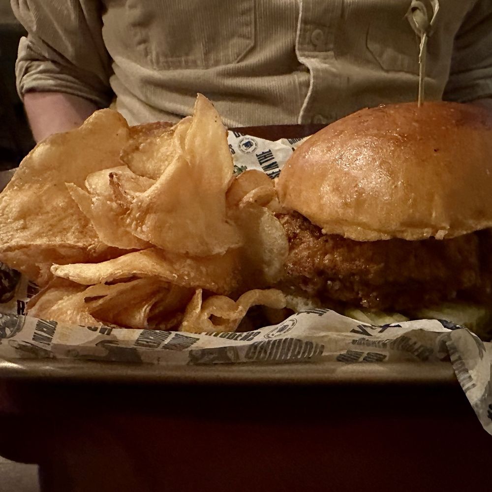 Syracuse Whiskey Coop - Nashville Hot Chicken sandwich with chips - American Near Me - Syracuse, New York Syracuse Whiskey Coop - Nashville Hot Chicken sandwich with chips - American Near Me - Syracuse, New York