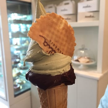 Emilia Cremeria - Such rich, creamy, delicious gelato! 72% Belgian chocolate and pistachio flavours, with melted chocolate lining the inside of the cone! - Ice Cream & Frozen Yogurt Near Me - Parma, Puerto Rico