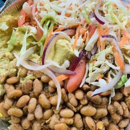 Yellow rice, pinto beans, curry chicken, yucca, and coleslaw Yellow rice, pinto beans, curry chicken, yucca, and coleslaw