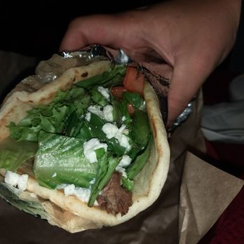 Presst Food & Wine - a person holding a pita - New American Near Me - Seneca, South Carolina Presst Food & Wine - a person holding a pita - New American Near Me - Seneca, South Carolina