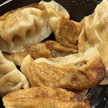 Meet Rice - Pan Fried 63. Pork Dumplings (8) - Chinese Near Me - Massapequa, New York