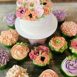 Decadent - Floral first birthday cake and cupcakes