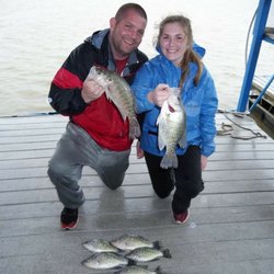 Huck Fin's Guide Service - Cold and rainy but daddy's girl proved to be super tough and out fished her dad.... again!