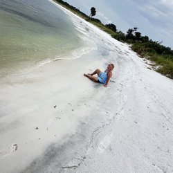 My daughter on the empty beach at shell island