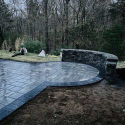 Level 10 Landworks & Facility Care - Concrete paver patio and half-moon wall