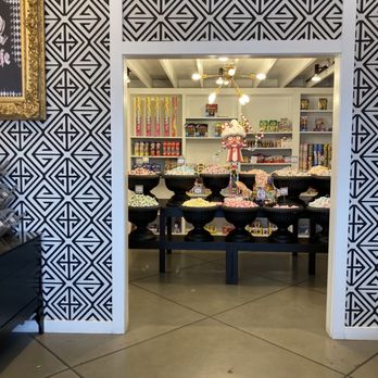 Pinkitzel - a woman standing in a store - Cupcakes Near Me - Tulsa, Oklahoma