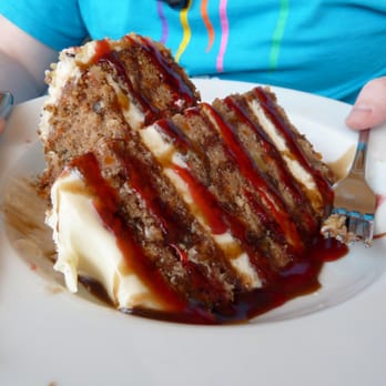 8 Mile Grill and Bar - GIANT carrot cake (and this is after some slices were taken off of it). - American Near Me - Cañon City, Colorado 8 Mile Grill and Bar - GIANT carrot cake (and this is after some slices were taken off of it). - American Near Me - Cañon City, Colorado