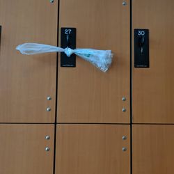 Sava Pool - There are signs posted reminding pool users to lock up their belongs---this person used a plastic bag.