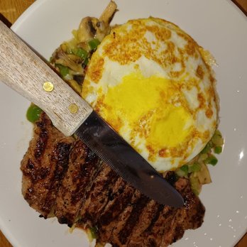 Scrambled - New York steak a Over vegetables, and a side of fried eggs - Breakfast & Brunch Near Me - Henderson, Nevada Scrambled - New York steak a Over vegetables, and a side of fried eggs - Breakfast & Brunch Near Me - Henderson, Nevada