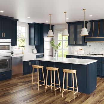 VCT Kitchen And Bath - a large kitchen with blue cabinets and white countertops - General Contractors Near Me - Columbia, Maryland VCT Kitchen And Bath - a large kitchen with blue cabinets and white countertops - General Contractors Near Me - Columbia, Maryland