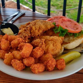 The Deck - Fried chicken sandwich with lettuce, tomatoes and a side of mayo and a hefty amount of tots! - American Near Me - Fort Wayne, Indiana