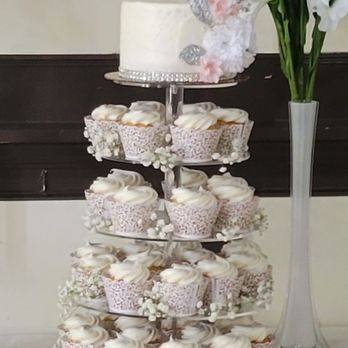 McCrum's Bakery - Cupcake tower with 6 in round 3 layer cake on top! - Desserts Near Me - Elmwood Park, New Jersey McCrum's Bakery - Cupcake tower with 6 in round 3 layer cake on top! - Desserts Near Me - Elmwood Park, New Jersey