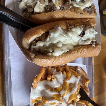 Famous Philly’s Cheesesteak Grill - two hot dogs and fries - Cheesesteaks Near Me - Daytona Beach, Florida Famous Philly’s Cheesesteak Grill - two hot dogs and fries - Cheesesteaks Near Me - Daytona Beach, Florida