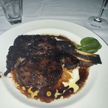 The Capital Grille - Porcini-Rubbed Bone-In Ribeye with 15-Year Aged Balsamic - Steakhouses Near Me - Houston, Texas The Capital Grille - Porcini-Rubbed Bone-In Ribeye with 15-Year Aged Balsamic - Steakhouses Near Me - Houston, Texas