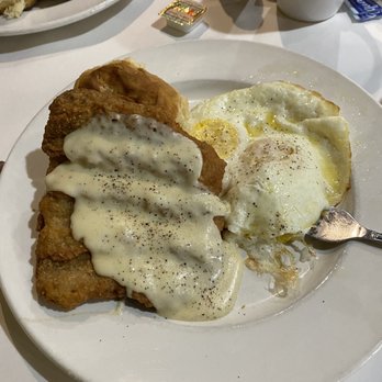 Ema's Cafe - Chicken Fried Steak with eggs milk gravy and cheese grits. - Cafes Near Me - Lafayette, Louisiana