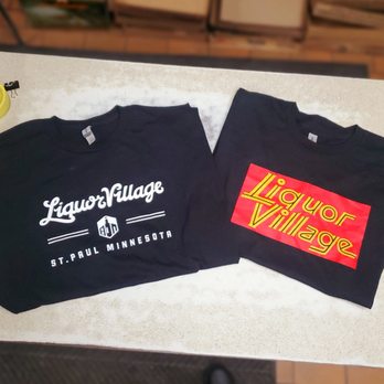 Liquor Village - two t - shirts on a counter - Beer, Wine & Spirits Near Me - Saint Paul, Minnesota Liquor Village - two t - shirts on a counter - Beer, Wine & Spirits Near Me - Saint Paul, Minnesota