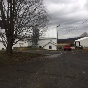 Sprucegate Farm - a red truck parked in front of a white barn - CSA Near Me - Walden, New York