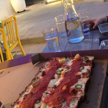 Ghost Box Pizza by Stem Ciders - Ghost pig Detroit style pizza in their outside dining area - Pizza Near Me - Lafayette, Colorado Ghost Box Pizza by Stem Ciders - Ghost pig Detroit style pizza in their outside dining area - Pizza Near Me - Lafayette, Colorado