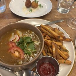 Vegan girl dinner & arancini during happy hour (pozole, fries, and a glass of wine)