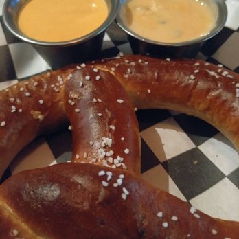 The Mucky Duck Bar - Pretzel with spicy mustard and cheese - Pubs Near Me - Addison, Texas The Mucky Duck Bar - Pretzel with spicy mustard and cheese - Pubs Near Me - Addison, Texas