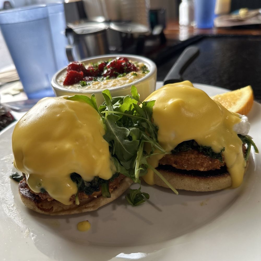 Backwater - Fried Green Tomato & Spinach Eggs Benedict with black cherry grits - Breakfast & Brunch Near Me - Melbourne, Florida Backwater - Fried Green Tomato & Spinach Eggs Benedict with black cherry grits - Breakfast & Brunch Near Me - Melbourne, Florida