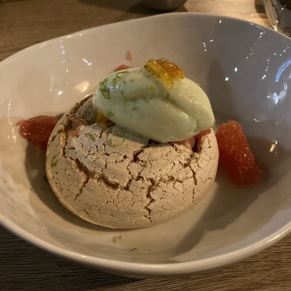 Rose Gose - Pavlova with Sorbet -- grapefruit pieces, lime sorbet, candied orange peel, inside with coconut milk/cream - Cocktail Bars Near Me - Austin, Texas Rose Gose - Pavlova with Sorbet -- grapefruit pieces, lime sorbet, candied orange peel, inside with coconut milk/cream - Cocktail Bars Near Me - Austin, Texas