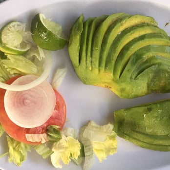 Lighthouse Cafe - Avocado Salad Seasonal, served without any irony at $6.95. When someone tells you that presentation doesn't matter, show them this picture. - Cafes Near Me - Key Biscayne, Florida