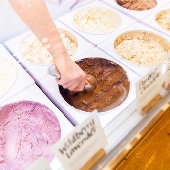 Jeni's Splendid Ice Creams - a woman's hand reaching for a scoop of ice cream - Ice Cream & Frozen Yogurt Near Me - Chagrin Falls, Ohio Jeni's Splendid Ice Creams - a woman's hand reaching for a scoop of ice cream - Ice Cream & Frozen Yogurt Near Me - Chagrin Falls, Ohio