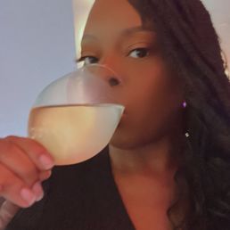 Enjoying my white wine at the bar! Enjoying my white wine at the bar!