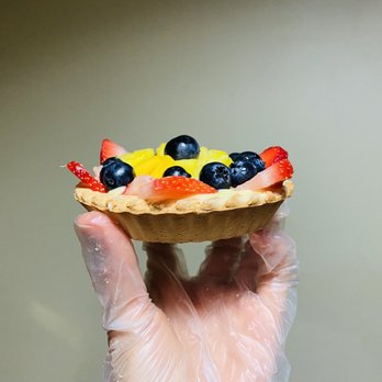 Panameria Bakery - a hand holding a pastry - Bakeries Near Me Panameria Bakery - a hand holding a pastry - Bakeries Near Me